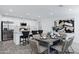 Open-concept design with kitchen island and dining area, ideal for modern living and entertaining at 1521 E Del Rio Dr, Tempe, AZ 85282