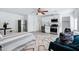 Bright living space featuring stainless appliances, bed, ceiling fan, and white walls at 1521 E Del Rio Dr, Tempe, AZ 85282