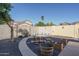 Landscaped backyard with stone pathway and wooden planters at 15514 W Ironwood St, Surprise, AZ 85374