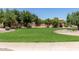 Open green space with paved walkway and landscaping at 1651 E Redwood Pl, Chandler, AZ 85286