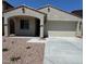 Charming single-story home with a two-car garage, low-maintenance landscaping and covered entry at 16768 W Hope Dr, Surprise, AZ 85388