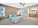 Spacious bedroom with a queen-size bed and lots of natural light at 18022 N Hyacinth Dr, Sun City West, AZ 85375