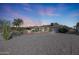 Rear view of the house, showcasing a spacious backyard at 19402 N Willow Creek Cir, Sun City, AZ 85373