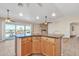 Spacious kitchen island with granite countertop and wood cabinets at 21113 S 223Rd Way, Queen Creek, AZ 85142