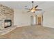 Spacious living room featuring a stone fireplace and high ceilings at 21113 S 223Rd Way, Queen Creek, AZ 85142