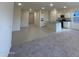 Open living room and kitchen area with tile and carpet flooring at 2113 E Bucking Bronco Dr, San Tan Valley, AZ 85140