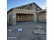 New home under construction; framing visible, garage area apparent at 2113 E Bucking Bronco Dr, San Tan Valley, AZ 85140