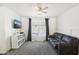 Bedroom with couch and large window at 22194 N Kingston Dr, Maricopa, AZ 85138