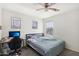 Bedroom with a double bed, desk, and window at 22194 N Kingston Dr, Maricopa, AZ 85138
