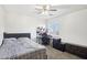 Spacious bedroom with a double bed and built-in desk at 22194 N Kingston Dr, Maricopa, AZ 85138
