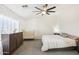 Bedroom with dresser, crib and large bed at 22194 N Kingston Dr, Maricopa, AZ 85138