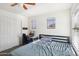 Bedroom with double bed, desk and window at 22194 N Kingston Dr, Maricopa, AZ 85138