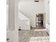 Bright entryway with wood-look floors and view to living area at 22194 N Kingston Dr, Maricopa, AZ 85138