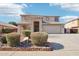 Two-story house with landscaped front yard and attached two-car garage at 22194 N Kingston Dr, Maricopa, AZ 85138
