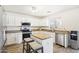 Modern kitchen with white cabinets, granite countertops and stainless steel appliances at 22194 N Kingston Dr, Maricopa, AZ 85138