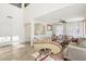 Spacious living room with high ceilings and large windows, hardwood floor at 22194 N Kingston Dr, Maricopa, AZ 85138