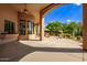 Covered patio with ceiling fans, offering views of the pool and garden at 26807 N 56Th St, Scottsdale, AZ 85266