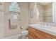 Well-appointed bathroom with a glass block window at 26807 N 56Th St, Scottsdale, AZ 85266