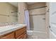 Updated bathroom with shower/tub and wood vanity at 26807 N 56Th St, Scottsdale, AZ 85266