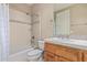 Clean bathroom with shower/tub combo and wood vanity at 26807 N 56Th St, Scottsdale, AZ 85266