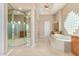 Spa-like bathroom with large soaking tub, double vanities, and glass shower at 26807 N 56Th St, Scottsdale, AZ 85266