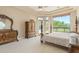 Bright bedroom with patio access and ornate furniture at 26807 N 56Th St, Scottsdale, AZ 85266