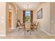 Formal dining room with glass table and ornate chairs at 26807 N 56Th St, Scottsdale, AZ 85266