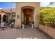 Inviting entryway with a wooden door and lush landscaping at 26807 N 56Th St, Scottsdale, AZ 85266