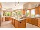 Open kitchen with granite island and stainless steel appliances at 26807 N 56Th St, Scottsdale, AZ 85266