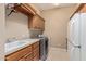 Laundry room with sink, washer, dryer, and cabinets at 26807 N 56Th St, Scottsdale, AZ 85266