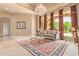 Bright living room features a chandelier and large windows at 26807 N 56Th St, Scottsdale, AZ 85266