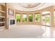 Bright living room with a fireplace and access to a patio at 26807 N 56Th St, Scottsdale, AZ 85266