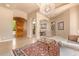 Open living room with decorative rug and entryway at 26807 N 56Th St, Scottsdale, AZ 85266