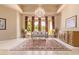Spacious living room with large windows, chandelier, and comfortable seating at 26807 N 56Th St, Scottsdale, AZ 85266