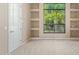 Bright office with built-in shelving and large window at 26807 N 56Th St, Scottsdale, AZ 85266