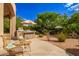Outdoor kitchen with pizza oven and seating area at 26807 N 56Th St, Scottsdale, AZ 85266
