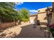 Side yard patio with grill and seating area at 26807 N 56Th St, Scottsdale, AZ 85266