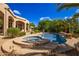 Stunning pool and spa with a large patio area and beautiful landscaping at 26807 N 56Th St, Scottsdale, AZ 85266
