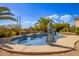Inviting kidney-shaped pool with a spa and a large patio area at 26807 N 56Th St, Scottsdale, AZ 85266