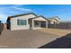 Backyard with gravel, patio, and block wall at 2837 W Apollo Rd, Phoenix, AZ 85041