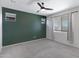 Bedroom with gray carpet, green accent wall, and window coverings at 2837 W Apollo Rd, Phoenix, AZ 85041