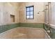 Substantial bathroom with shower, tiled walls and built-in seat at 28626 N 108Th N Way, Scottsdale, AZ 85262