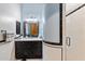 Modern bathroom with black vanity and white tile shower at 28626 N 108Th N Way, Scottsdale, AZ 85262