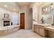 Elegant bathroom with soaking tub, double vanity, and separate shower at 28626 N 108Th N Way, Scottsdale, AZ 85262