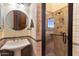 Bathroom with pedestal sink and walk-in shower at 28626 N 108Th N Way, Scottsdale, AZ 85262