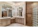 Elegant bathroom with double vanity, glass shower, and large mirrors at 28626 N 108Th N Way, Scottsdale, AZ 85262
