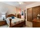 Charming bedroom with wooden furniture and floral bedding at 28626 N 108Th N Way, Scottsdale, AZ 85262