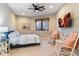 Spacious bedroom with two rocking chairs and large TV at 28626 N 108Th N Way, Scottsdale, AZ 85262