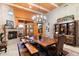 Spacious dining room with a large wood table and fireplace at 28626 N 108Th N Way, Scottsdale, AZ 85262
