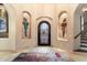 Grand entryway with unique artwork and wrought-iron door at 28626 N 108Th N Way, Scottsdale, AZ 85262